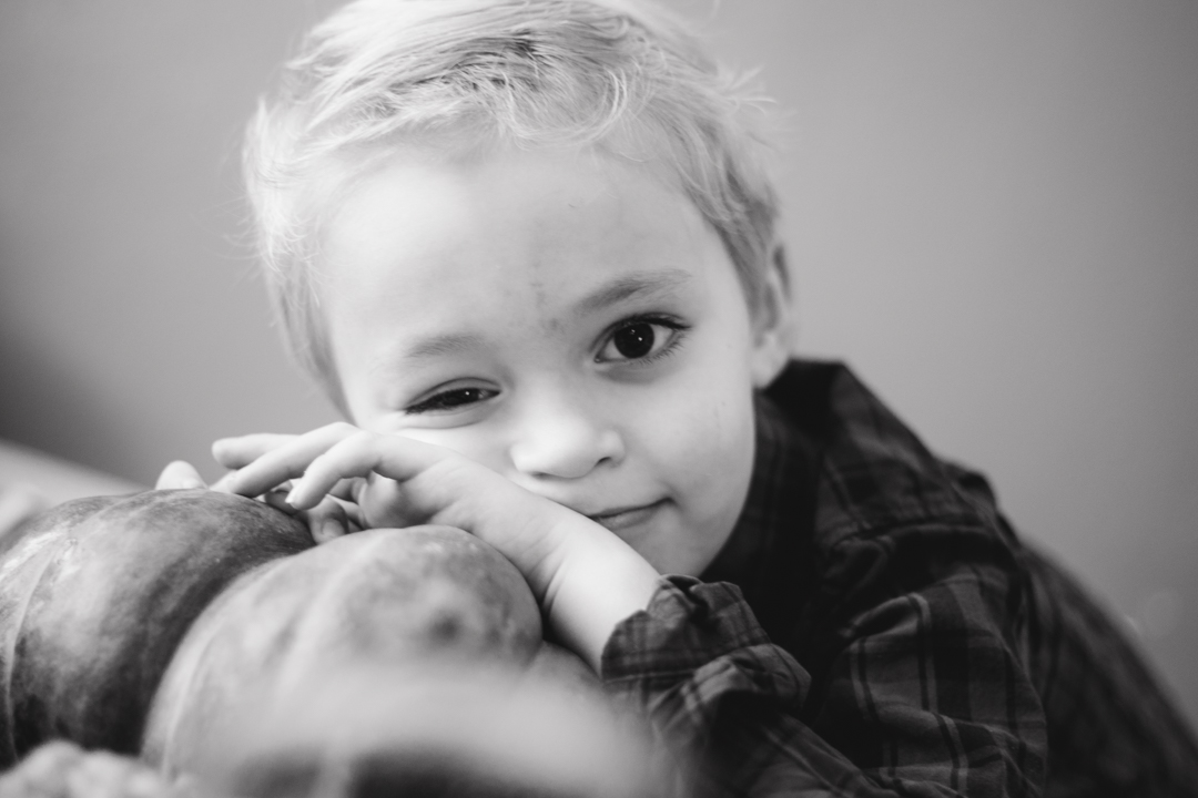 Newborn photography session — big brother with baby